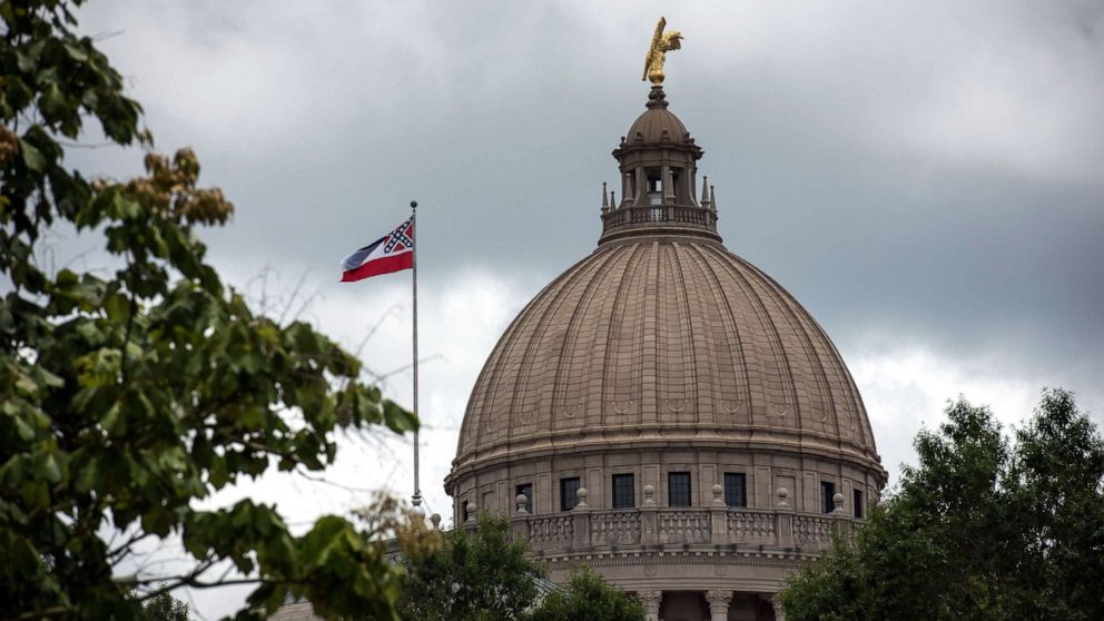PHOTO: The state flag flies over the Mississippi State Capitol building in Jackson, Mississippi, June 29, 2020.