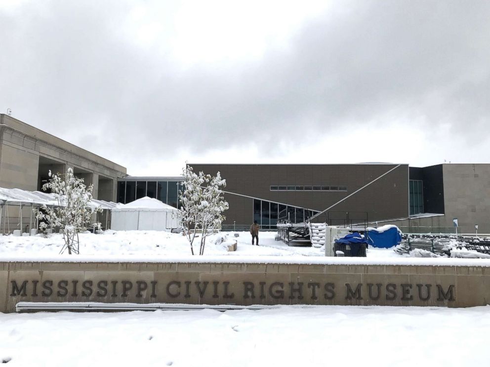 PHOTO: Snow blankets the plaza of the Mississippi Civil Rights Museum in Jackson, Miss., as workers prepare the grounds for opening day ceremonies, Dec. 8, 2017.