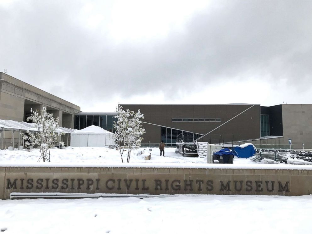 PHOTO: Snow blankets the plaza of the Mississippi Civil Rights Museum in Jackson, Miss., as workers prepare the grounds for opening day ceremonies, Dec. 8, 2017.