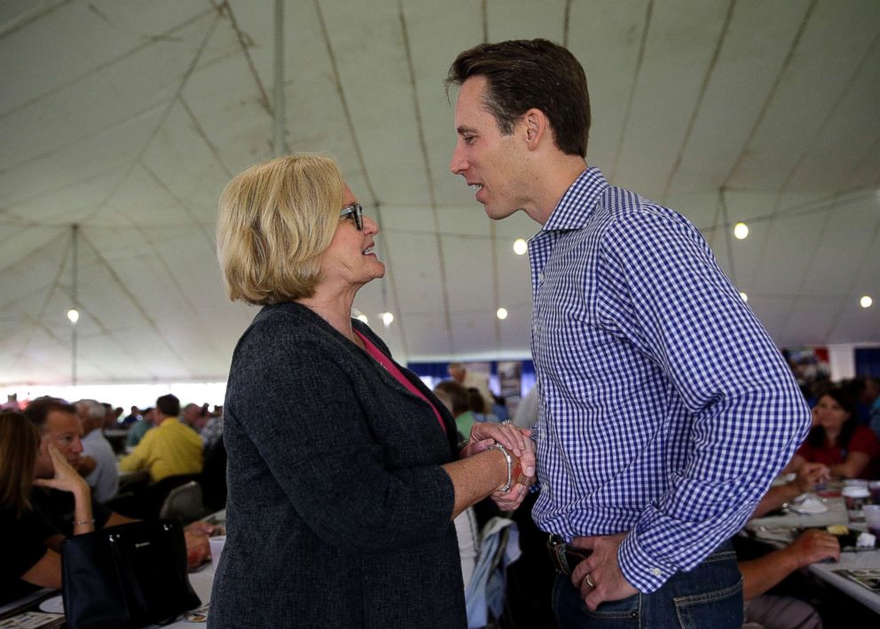 PHOTO: Missouri Senator Claire McCaskill talks with Missouri Attorney General and likely Republican challenger Josh Hawley during the Governor's Ham Breakfast at the Missouri State Fair in Sedalia, Mo., Aug. 17, 2017.