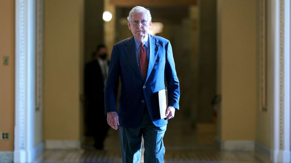 PHOTO: Senate Minority Leader Mitch McConnell walks to the chamber for a test vote on a government spending bill, at the Capitol, Sept. 27, 2021. 