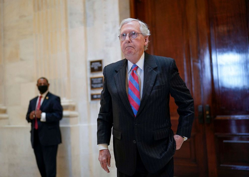 PHOTO: Senate Minority Leader Mitch McConnell returns to the Senate chamber for a vote after attending a bipartisan barbecue luncheon, at the Capitol, Sept. 23, 2021. 