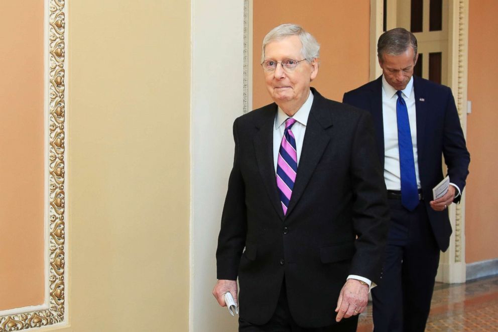 PHOTO: Senate Majority Leader Mitch McConnell walks to speak to reporters on Capitol Hill in Washington, Feb. 26, 2019.