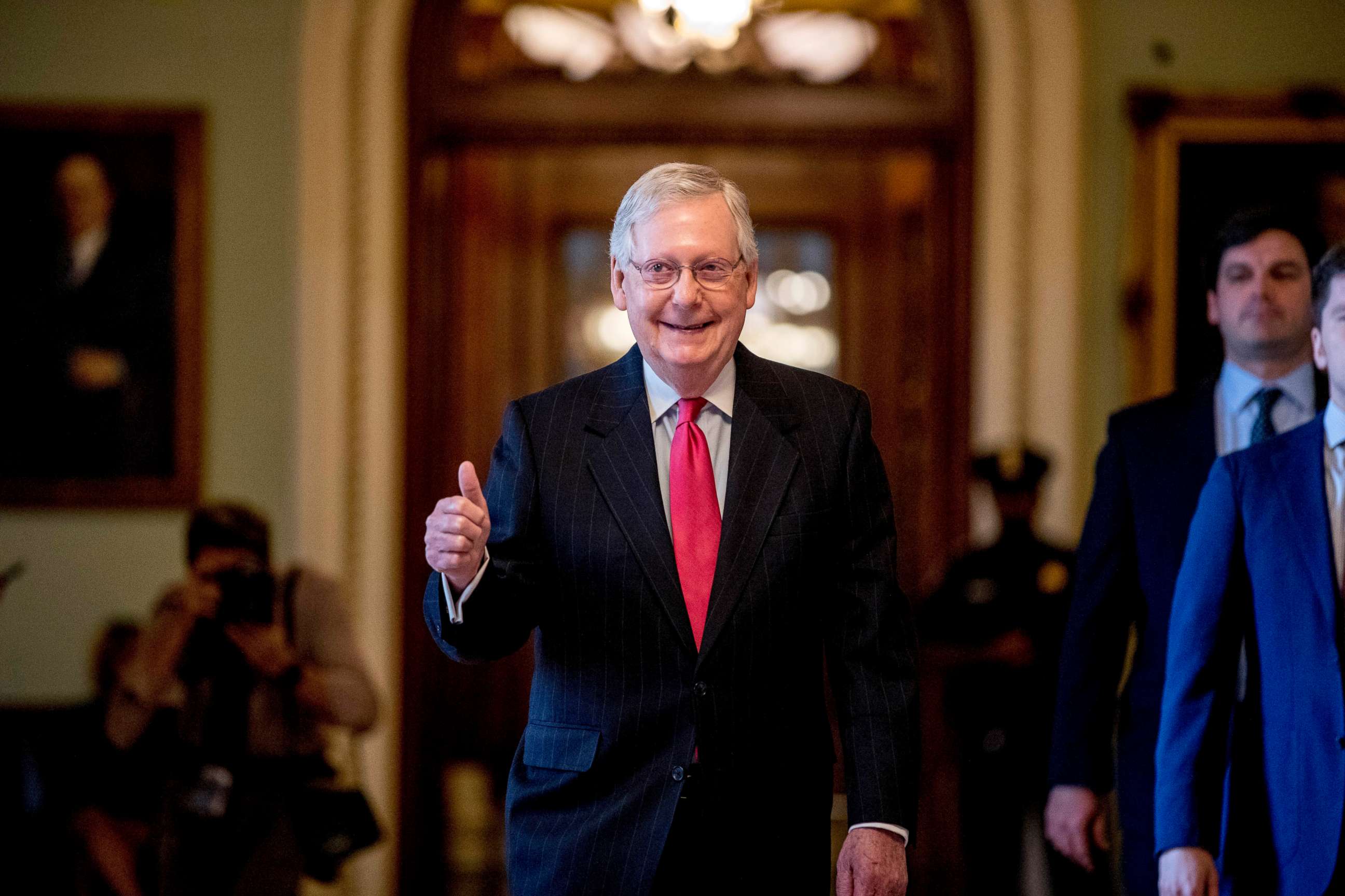 PHOTO: Senate Majority Leader Mitch McConnell gives a thumbs up as he leaves the Senate chamber on Capitol Hill in Washington, March 25, 2020, where a deal has been reached on a coronavirus bill.