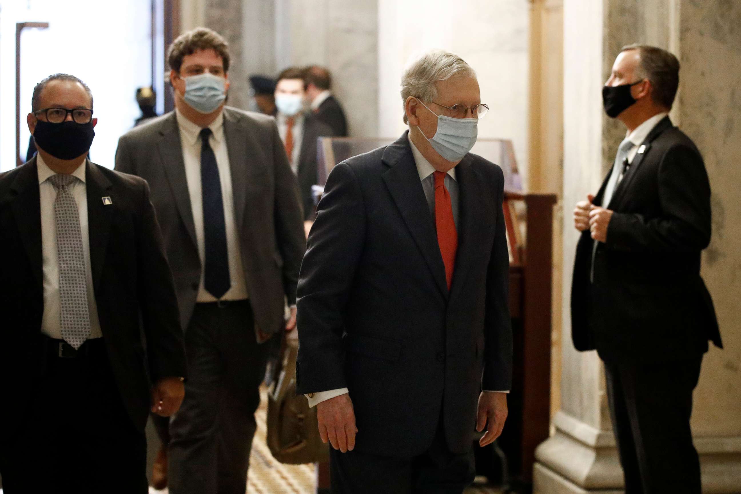 PHOTO: Senate Majority Leader Mitch McConnell wears a face mask to protect against the spread of the new coronavirus as he arrives on Capitol Hill in Washington.