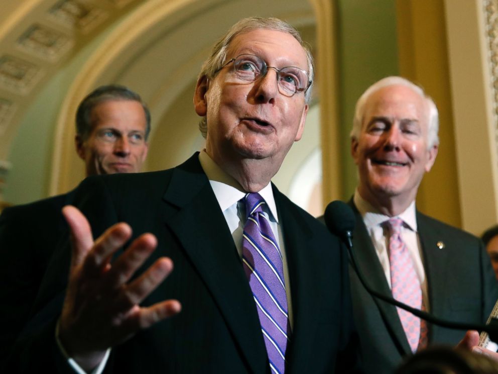 Senate Majority Leader Mitch McConnell of Ky., center, speaks during a media availability after a policy luncheon on Capitol Hill, Tuesday, May 8, 2018 in Washington.
