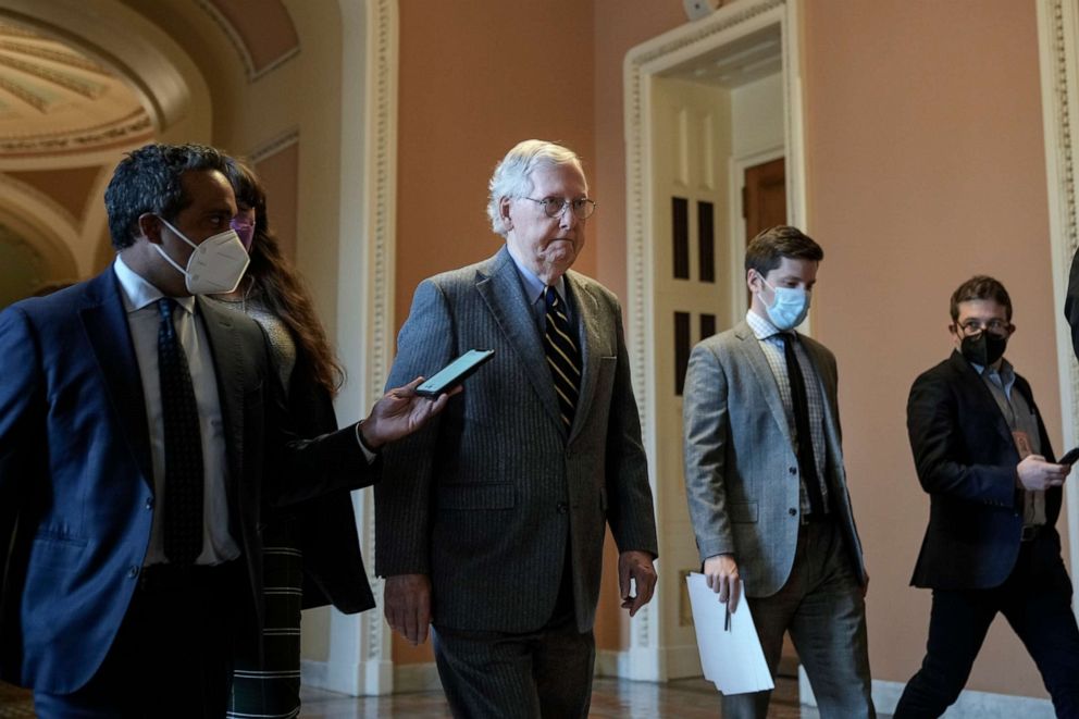 PHOTO: Senate Minority Leader Mitch McConnell speaks to reporters as he walks back to his office after speaking on the Senate floor at the U.S. Capitol on Jan. 5, 2022, in Washington, D.C.