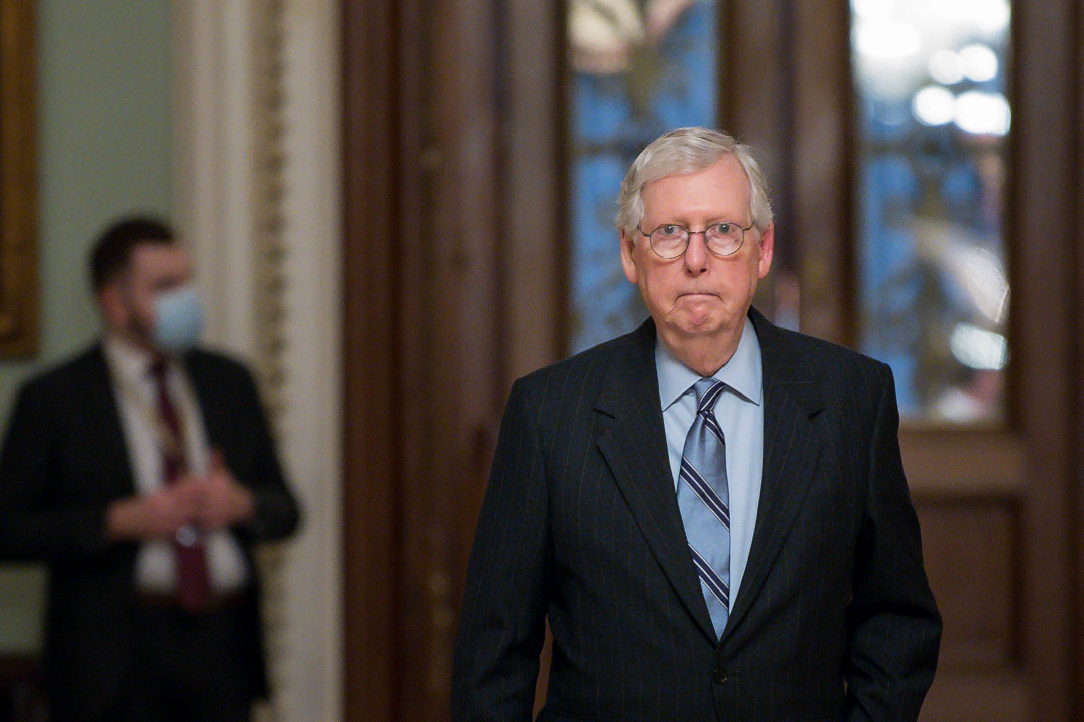 PHOTO: Senate Minority Leader Mitch McConnell leaves the Senate Chamber in the U.S. Capitol on Aug. 11, 2021, in Washington, D.C.