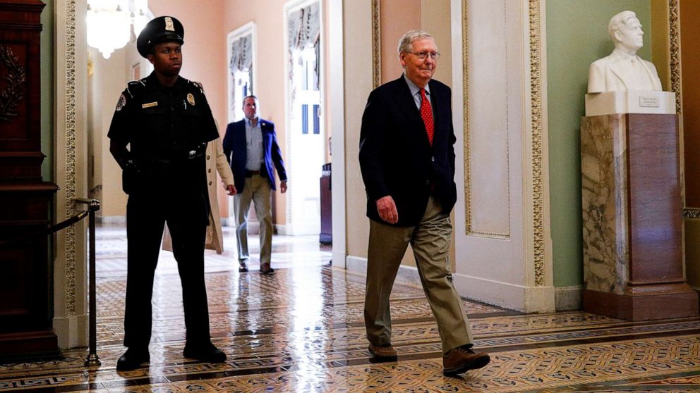 PHOTO: Senate Majority Leader Mitch McConnell walks through the Ohio clock corridor after it was announced that congressional leaders and the White House agreed on nearly $500 billion more in coronavirus relief, in Washington, April 21, 2020.