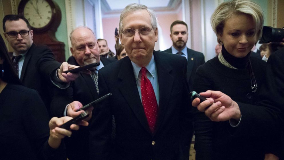 Senate Majority Leader Mitch McConnell tells reporters "we have the votes," after departing a closed-door meeting with Republican lawmakers to advance the stalled GOP overhaul of the tax code, on Capitol Hill in Washington, Dec. 1, 2017.
