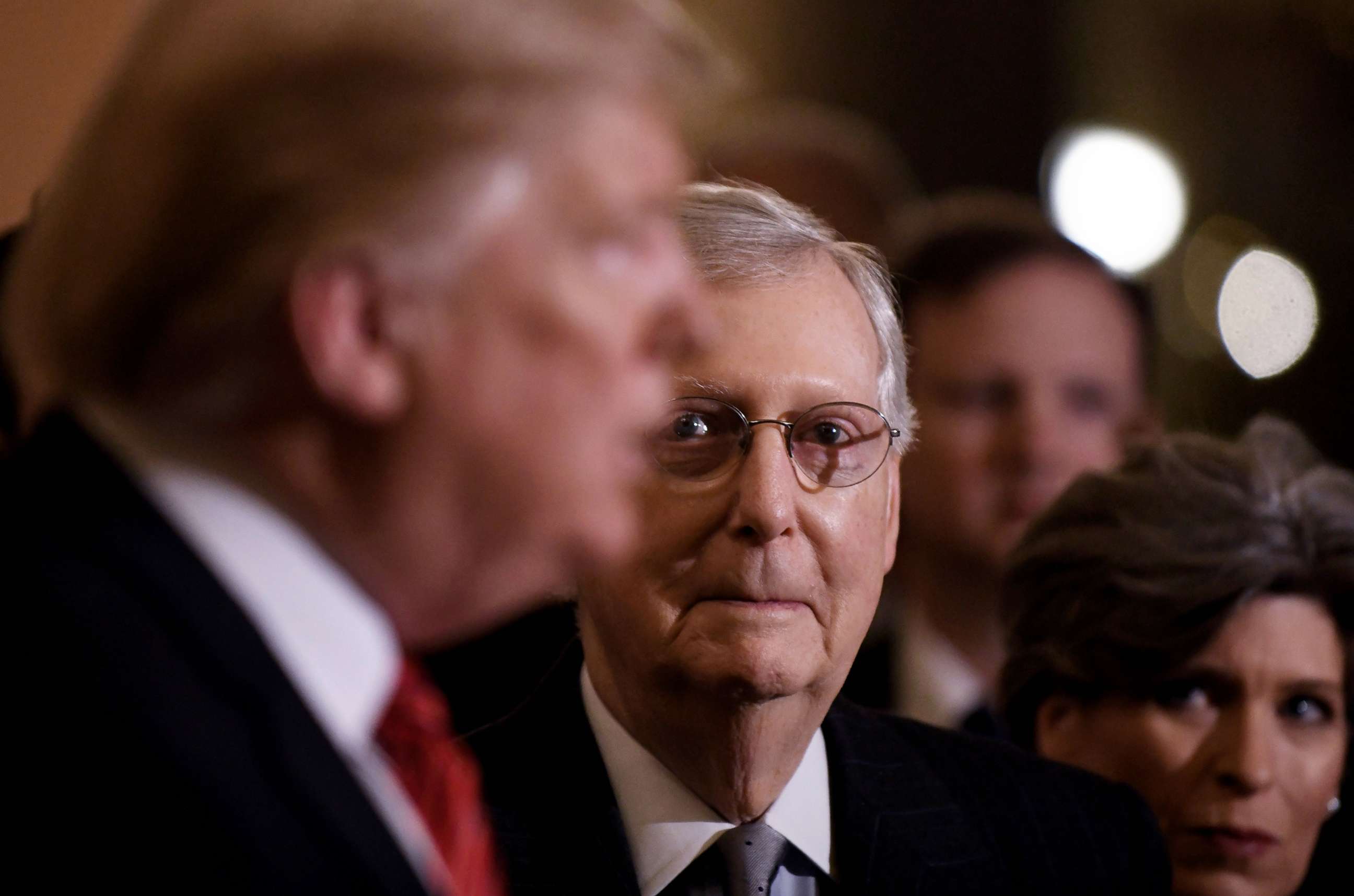 PHOTO: President Donald Trump talks to the press as Senate Majority Leader Mitch McConnell looks on after the Republican luncheon at the Capitol Hill in Washington, Jan. 9, 2019.
