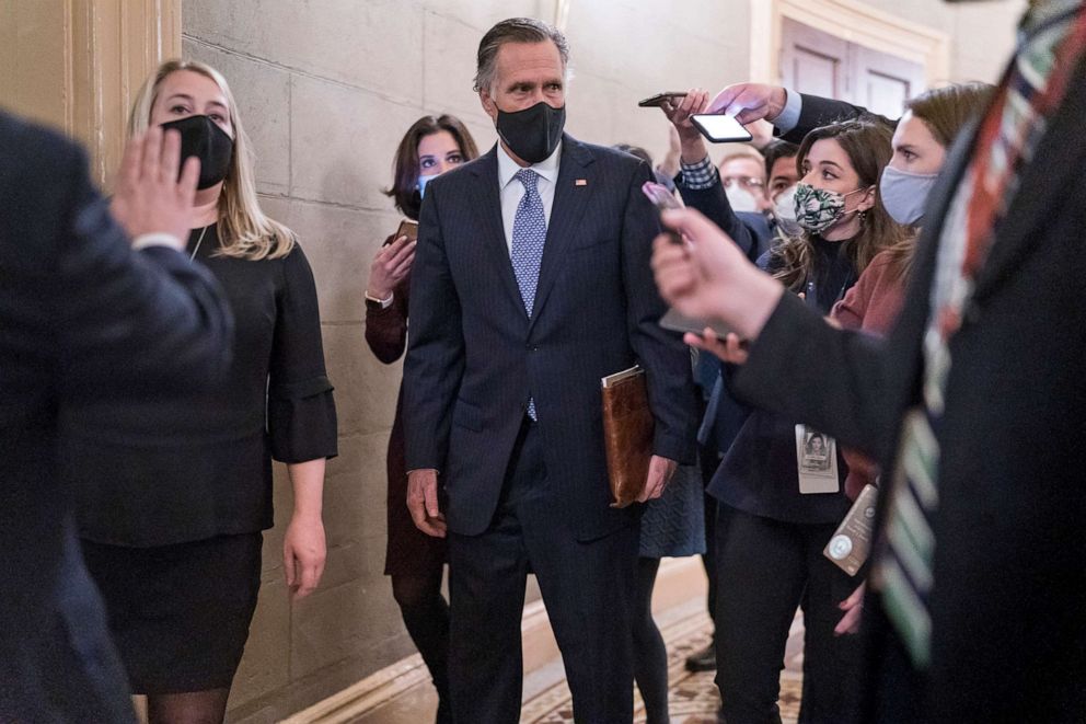 PHOTO: Reporters vie for a response from Sen. Mitt Romney, as Senators take a dinner break as arguments continue in former President Donald Trump's impeachment trial, at the Capitol in Washington, D.C., Feb. 10, 2021.