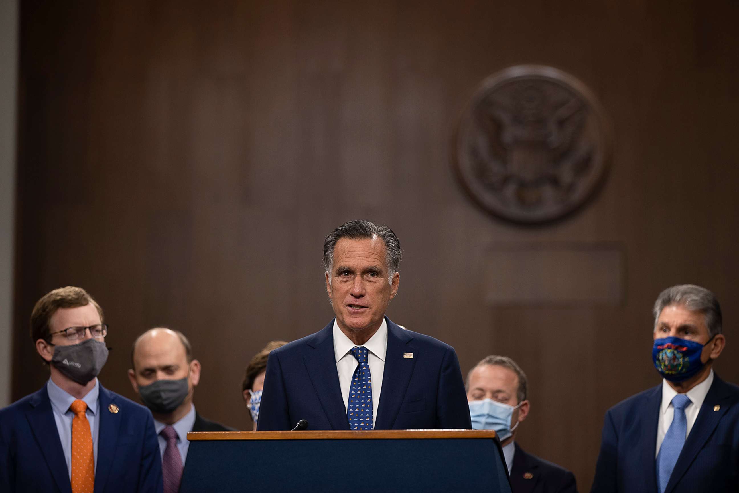 PHOTO: Sen. Mitt Romney speaks alongside a bipartisan group of Democrat and Republican members of Congress as they announce a proposal for a Covid-19 relief bill on Capitol Hill on Dec. 1, 2020, in Washington, DC.