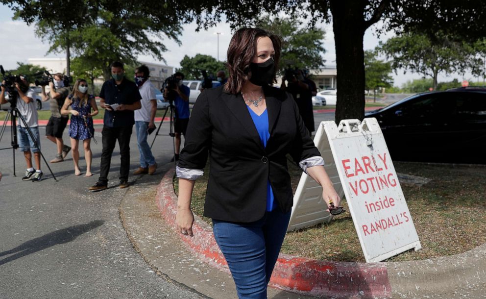 PHOTO: Democratic U.S. Senate candidate MJ Hegar heads to an early polling site after talking with the media, July 9, 2020, in Austin, Texas.