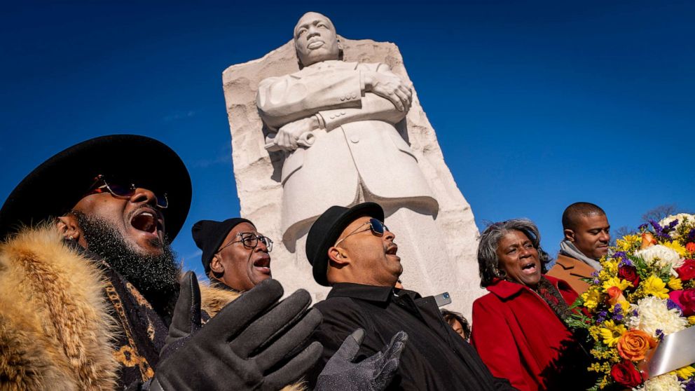 PHOTO: People sing during a wreath-laying ceremony at the Martin Luther King, Jr., Memorial on Martin Luther King Jr. Day in Washington, D.C., Jan. 16, 2023.