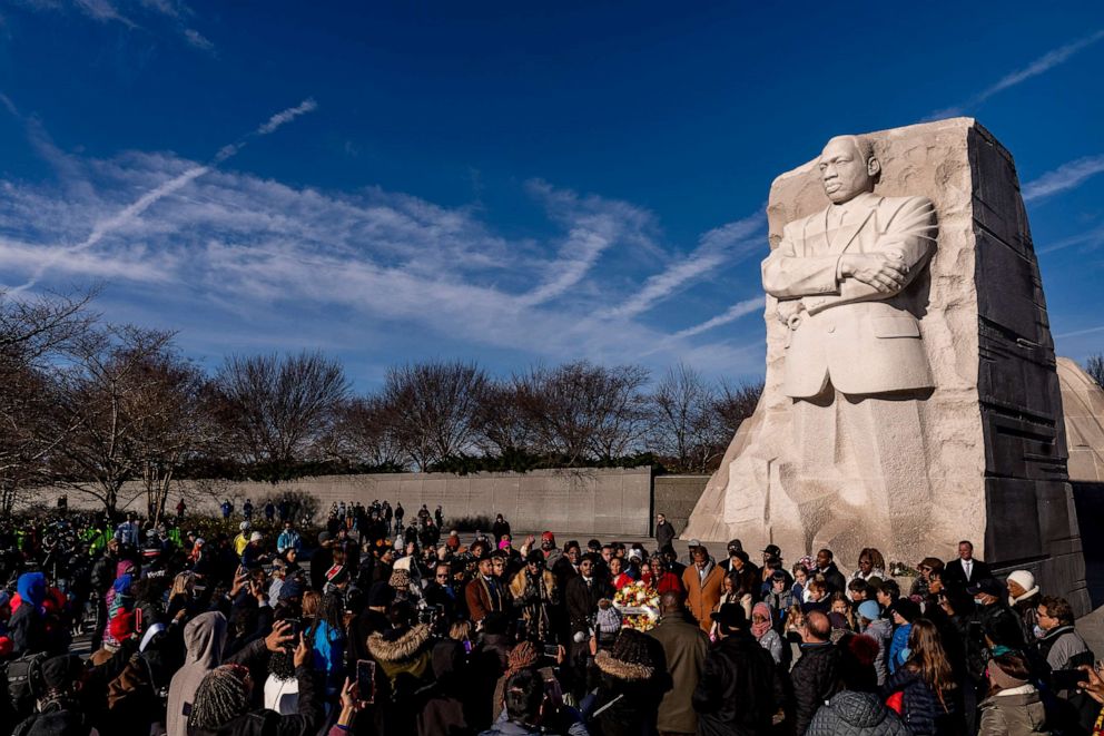 PHOTO: A large group gathers to watch a wreath-laying ceremony at the Martin Luther King Jr. Memorial on Martin Luther King Jr. Day in Washington, Jan. 16, 2023.