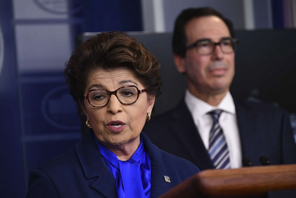 PHOTO: Jovita Carranza, administrator of the U.S. Small Business Administration (SBA), left, speaks as Steven Mnuchin, U.S. Treasury secretary, listens during a Coronavirus Task Force news conference at the White House in Washington, April 2, 2020.