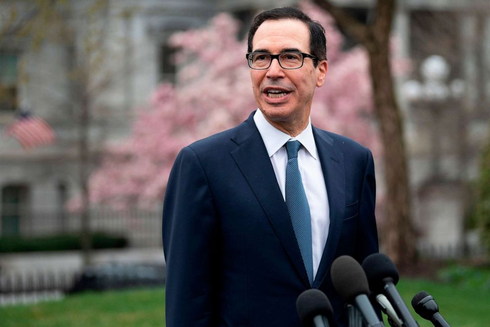 PHOTO: Treasury Secretary Steven Mnuchin speaks with reporters outside White House in Washington, DC, on March 13, 2020.