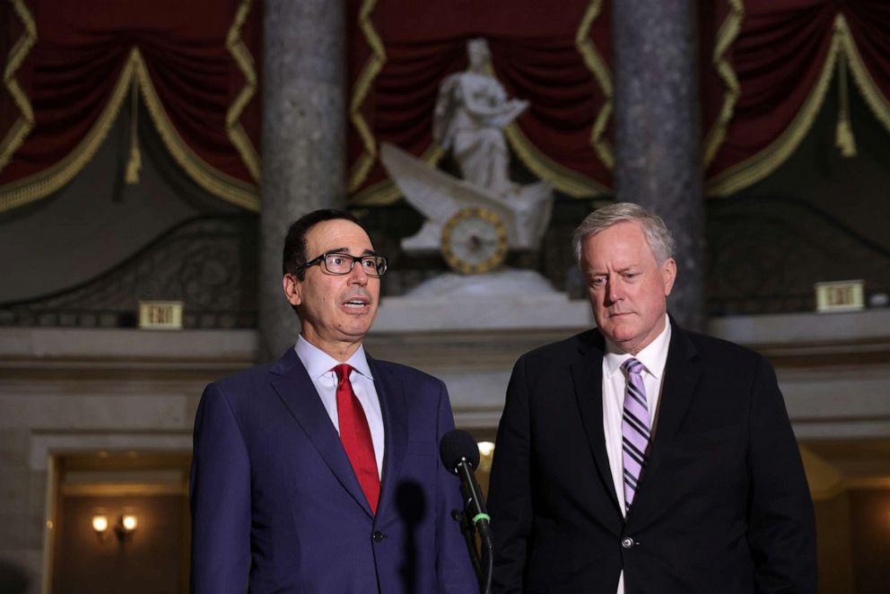 PHOTO: White House Chief of Staff Mark Meadows and Secretary of the Treasury Steven Mnuchin speak to members of the press after a meeting at the office of Speaker of the House Rep. Nancy Pelosi at the U.S. Capitol, Aug. 7, 2020 in Washington, DC.