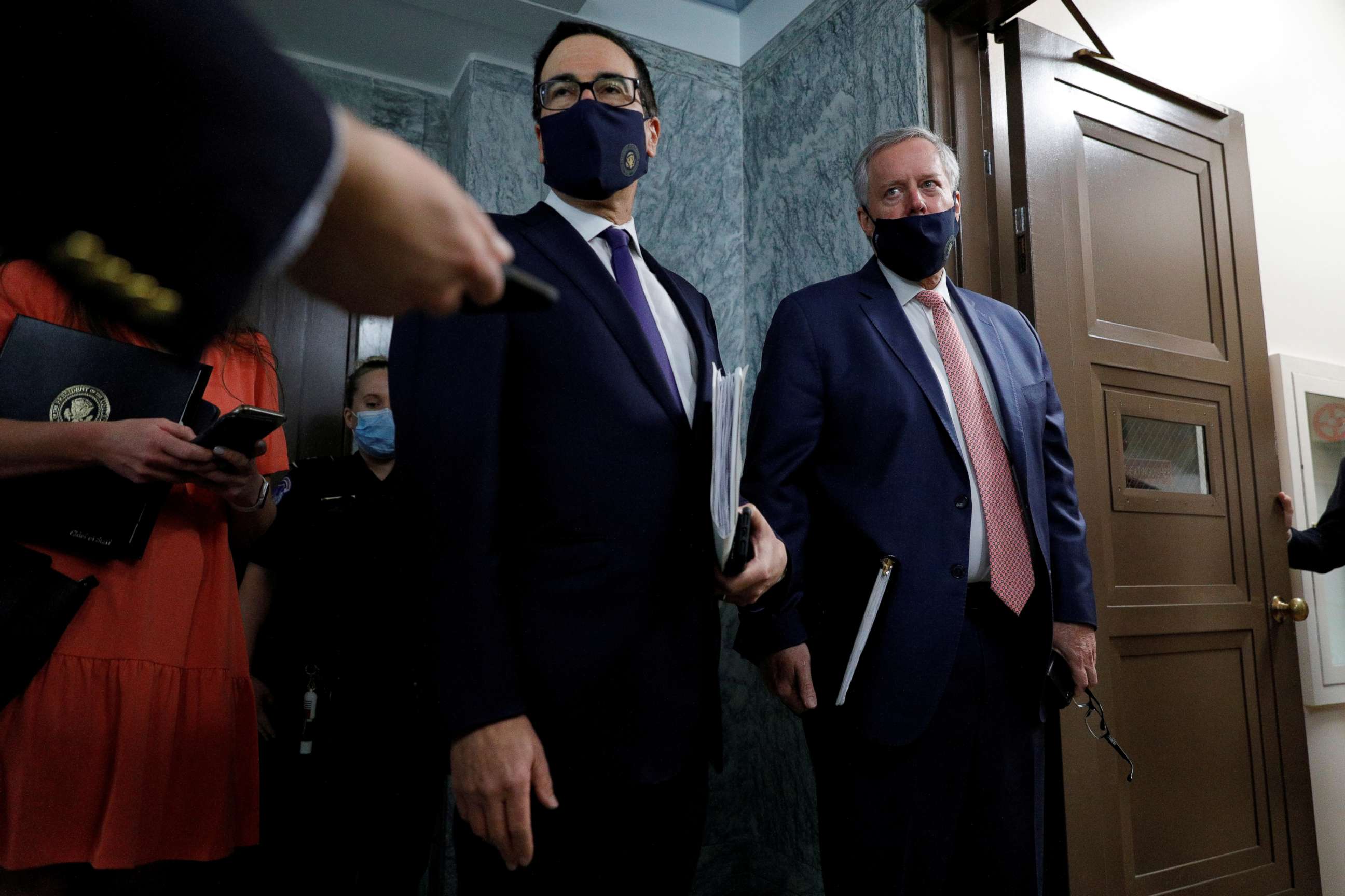 PHOTO: Treasury Secretary Steve Mnuchin and White House Chief of Staff Mark Meadows take questions from news reporters following a series of meetings on efforts to pass new coronavirus aid legislation on Capitol Hill in Washington, July 28, 2020.