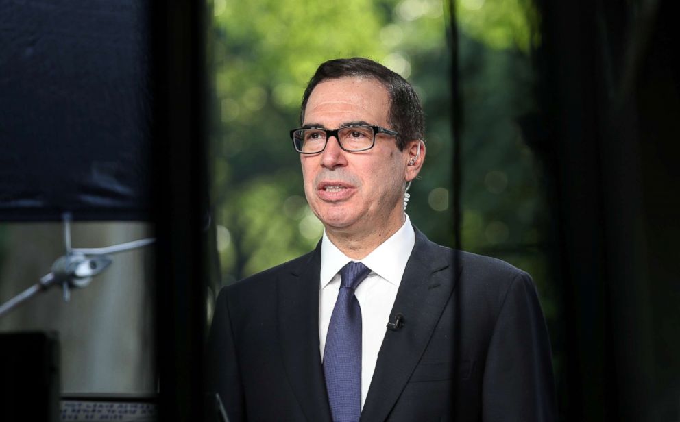 PHOTO: Treasury Secretary Steve Mnuchin speaks during a TV interview at the White House, May 21, 2018. 