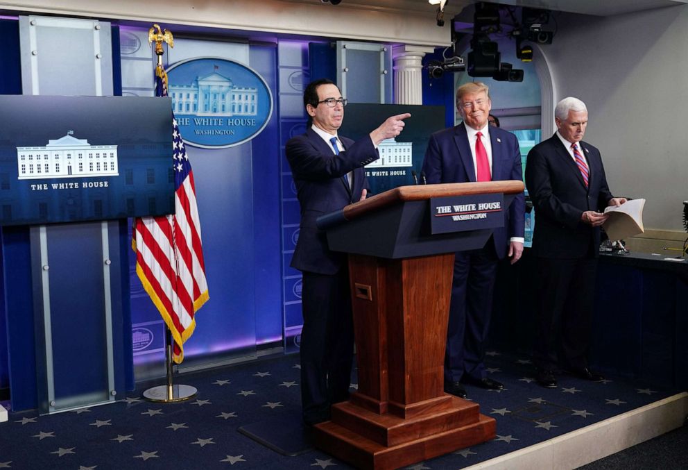 PHOTO: Secretary of the Treasury Steve Mnuchin, President Donald Trump, and Vice President Mike Pence participate in the daily briefing on COVID-19, in the Brady Briefing Room at the White House on April 13, 2020, in Washington, DC.