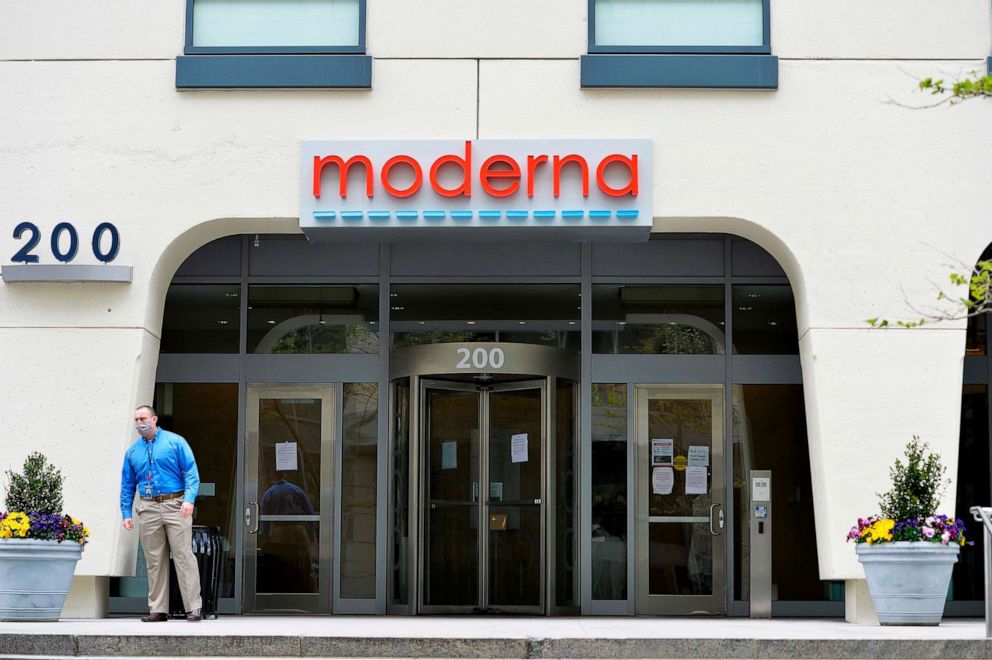 PHOTO: A man stands outside Moderna headquarters in Cambridge, Mass., on May 18, 2020.