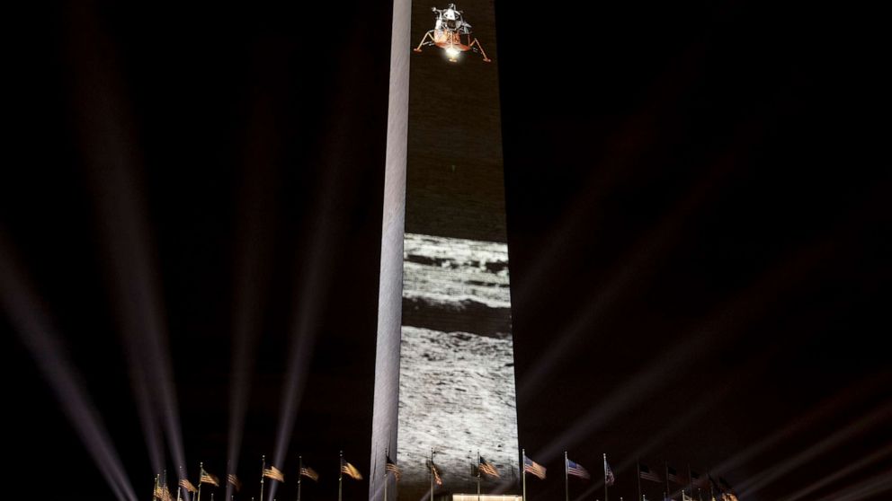 PHOTO: A spacecraft landing on the moon is projected on the east face of the Washington Monument in Washington, July 17, 2019, in celebration of the 50th anniversary of the Apollo 11 moon landing.