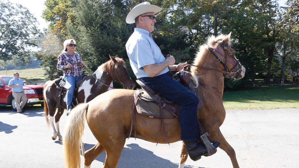 PHOTO: Alabama Republican U.S. Senate candidate Roy Moore on Sassy and wife Kayla on Sundance ride their horses to the Gallant Fire Hall to vote in the GOP runoff election Sept. 26, 2017 in Gallant, Ala.