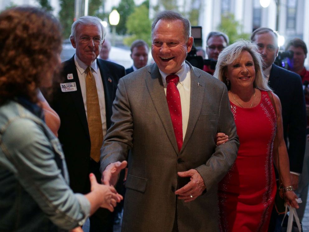 PHOTO: Republican candidate Roy Moore and his wife Kayla are greeted at the door as they arrive at the RSA Activity Center in Montgomery, Alabama, September 26, 2017, during the runoff election for the Republican nomination for Alabama's U.S. Senate seat.