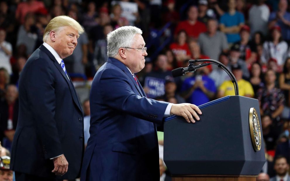 PHOTO: President Donald Trump, left, listens as Republican Senate candidate Patrick Morrisey, currently West Virginia Attorney General, speaks during a rally, Aug. 21, 2018, in Charleston, W.Va.