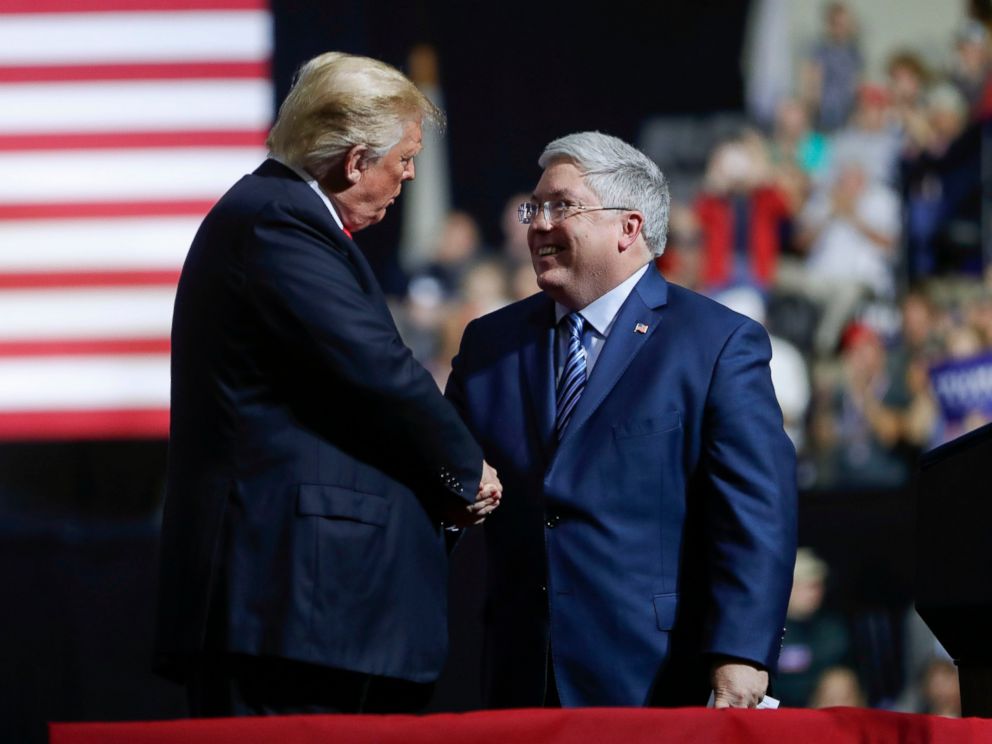 PHOTO: President Donald Trump, left, shakes hands with Republican Senate candidate Patrick Morrisey, right, on stage during a campaign rally at WesBanco Arena, Saturday, Sept. 29, 2018, in Wheeling, W.Va.