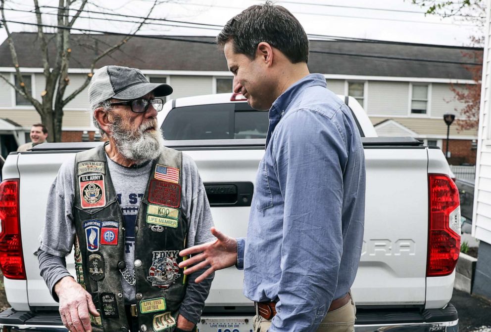 PHOTO:Democratic presidential candidate Rep. Seth Moulton, D-Mass., introduces himself as a presidential candidate as he goes to shake hands with Gerard St. Pierre during a campaign event held at Liberty House in Manchester, N.H., April 23, 2019.