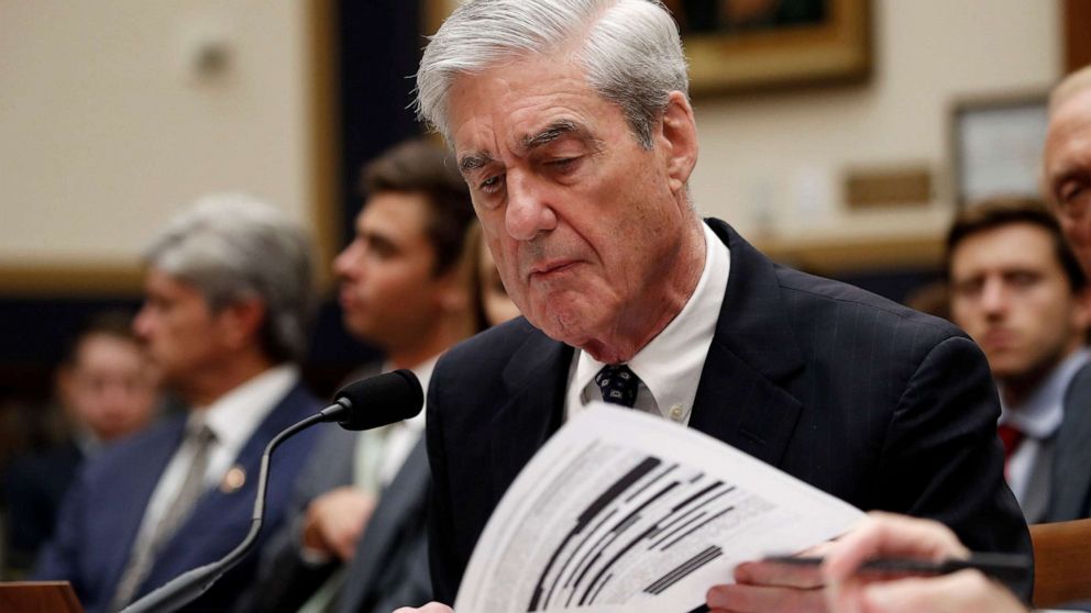 PHOTO: Former special counsel Robert Mueller checks pages in the report as he testifies before the House Judiciary Committee hearing on his report on Russian election interference, on Capitol Hill, July 24, 2019 in Washington, D.C.