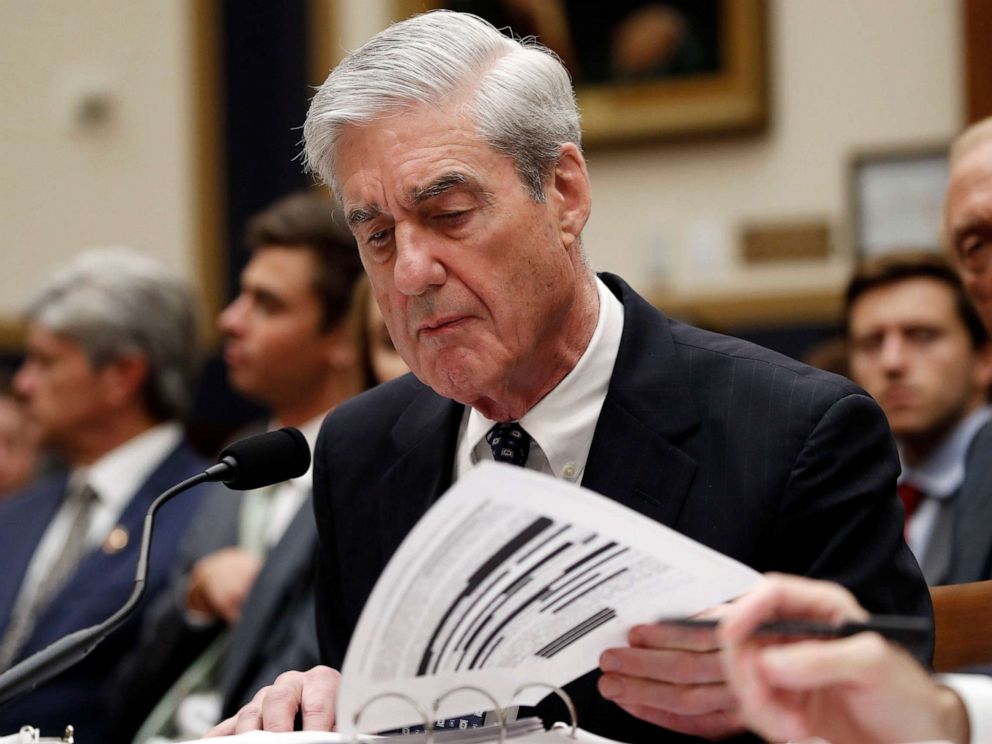 PHOTO: Former special counsel Robert Mueller checks pages in the report as he testifies before the House Judiciary Committee hearing on his report on Russian election interference, on Capitol Hill, July 24, 2019 in Washington, D.C.