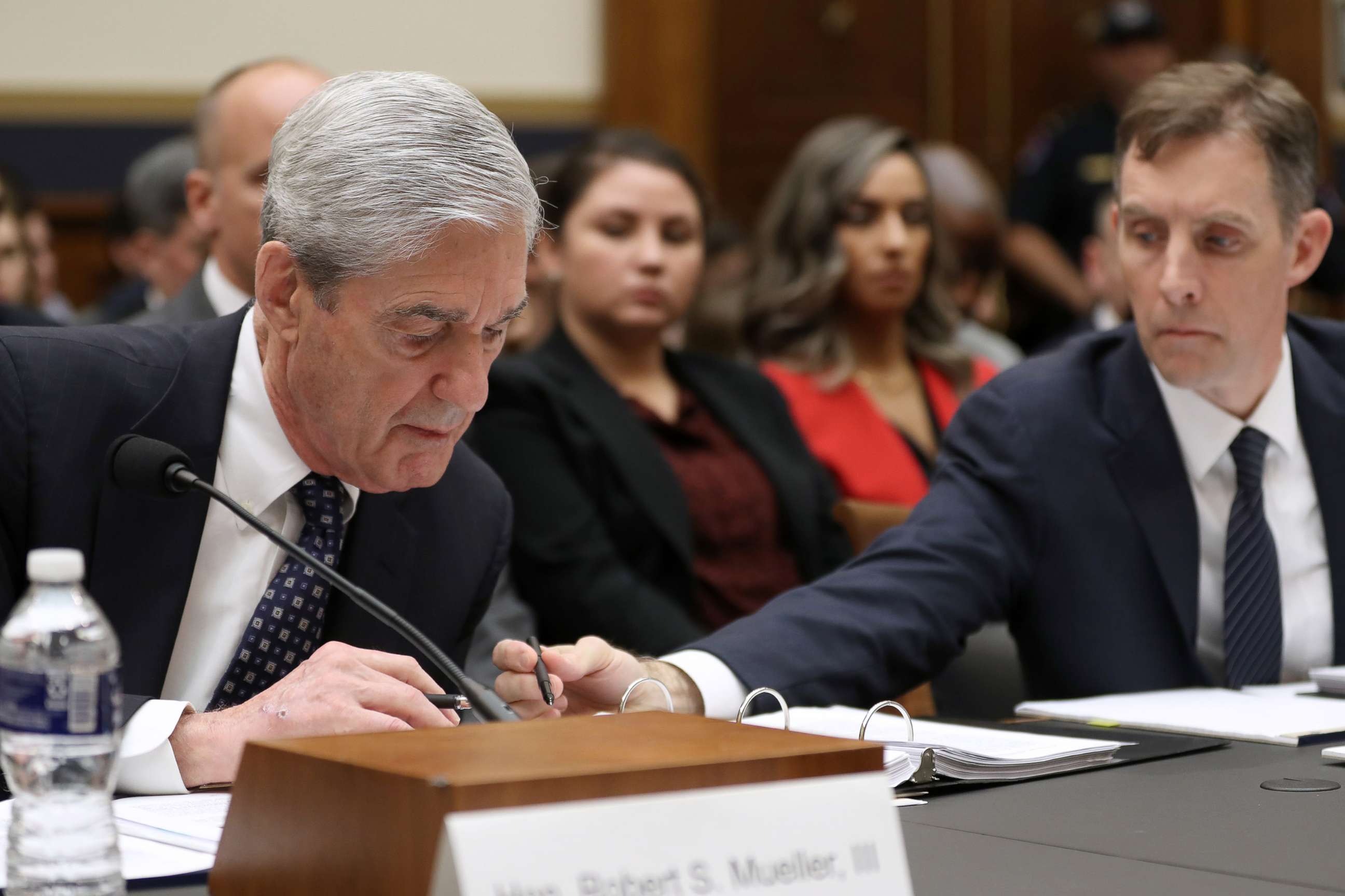 PHOTO: Former Special Counsel Robert Mueller and former Deputy Special Counsel Aaron Zebley, right, go over notes as Mueller testifies before the House Judiciary Committee about his report, July 24, 2019 in Washington, D.C.