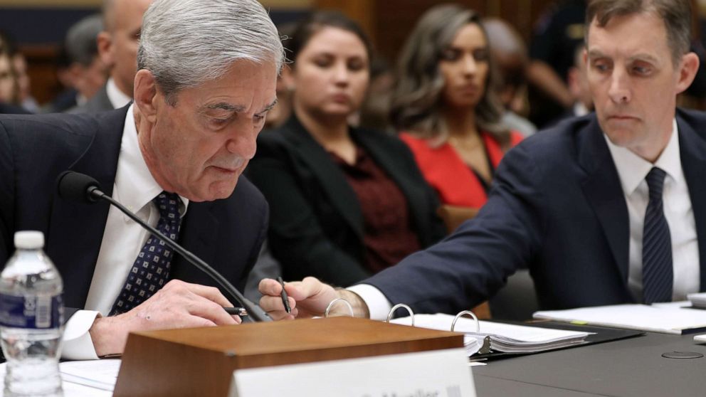 PHOTO: Former Special Counsel Robert Mueller and former Deputy Special Counsel Aaron Zebley, right, go over notes as Mueller testifies before the House Judiciary Committee about his report, July 24, 2019 in Washington, D.C.