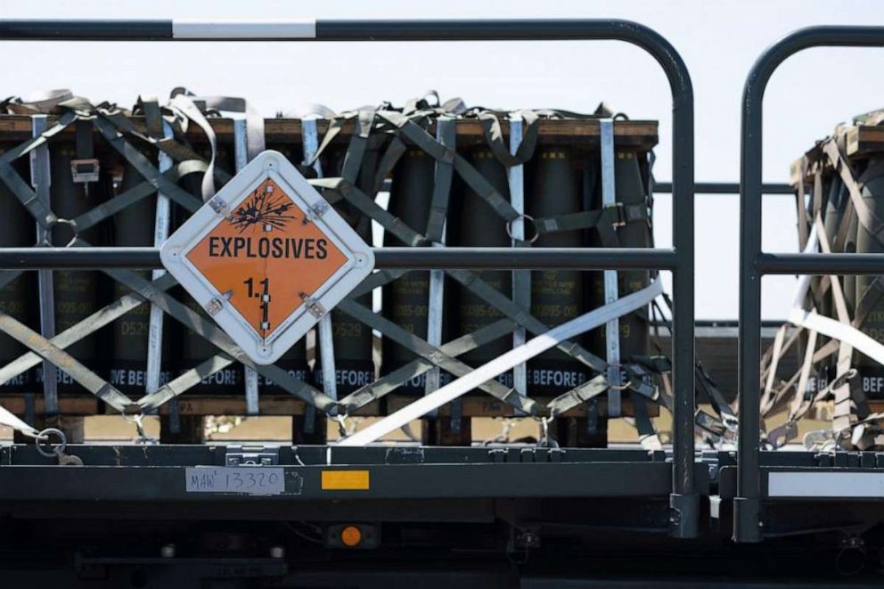 PHOTO: Pallets holding munitions are transported off an aircraft cargo loader into a Boeing 747 at Travis Air Force Base, California, April 28, 2022.