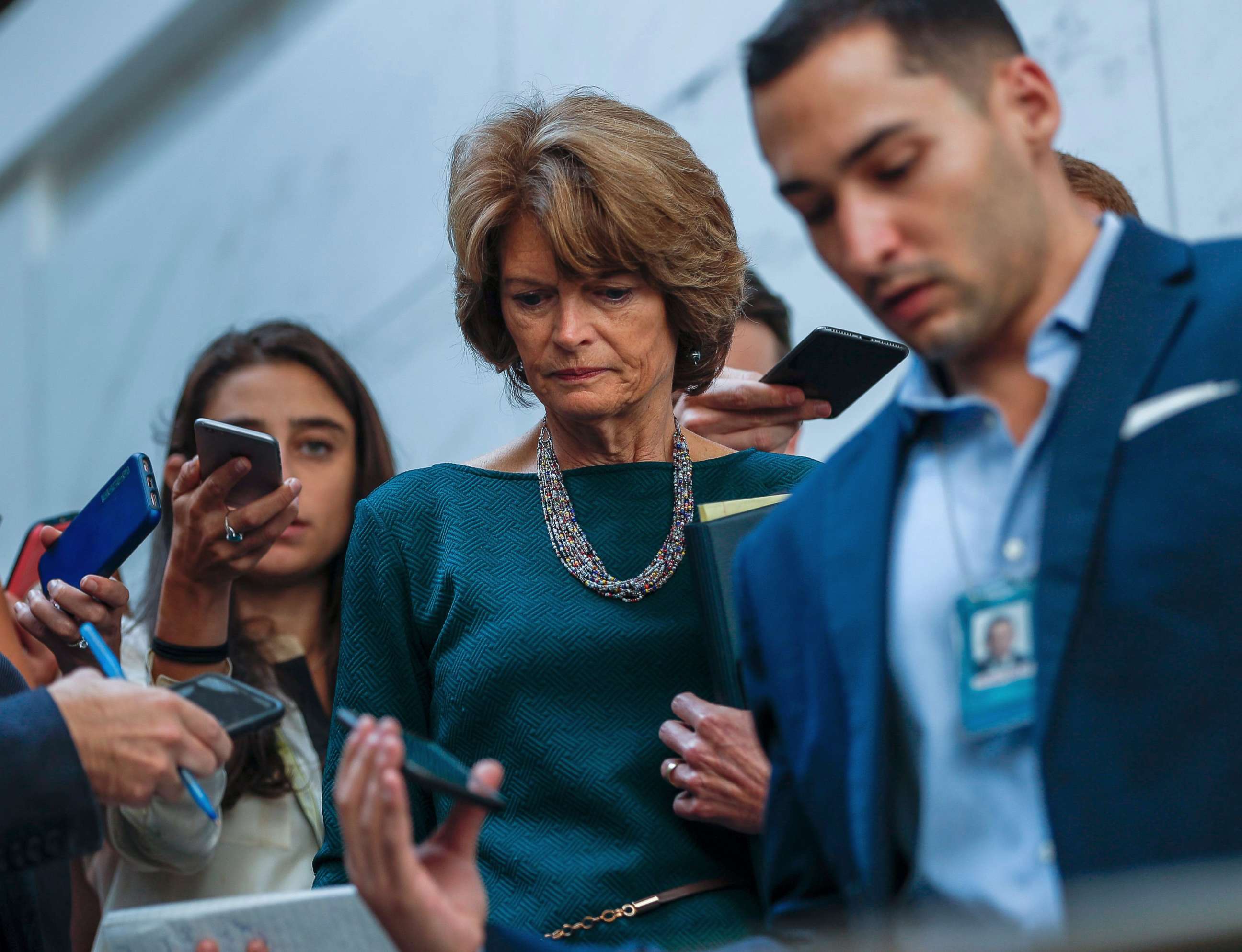 PHOTO: Republican Senator Lisa Murkowski from Alaska is surrounded by the media before viewing documents in the Senate Sensitive Compartmented Information Facility, or SCIF, in the US Capitol in Washington, Oct. 4, 2018. 