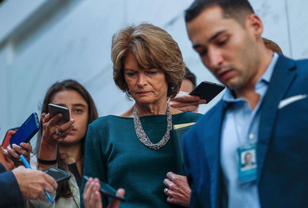 PHOTO: Republican Senator Lisa Murkowski from Alaska is surrounded by the media before viewing documents in the Senate Sensitive Compartmented Information Facility, or SCIF, in the US Capitol in Washington, Oct. 4, 2018. 