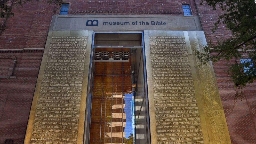 The entrance to the Museum of the Bible features relief metal lettering of scriptures in the Latin language, Oct. 4, 2017, in Washington. 