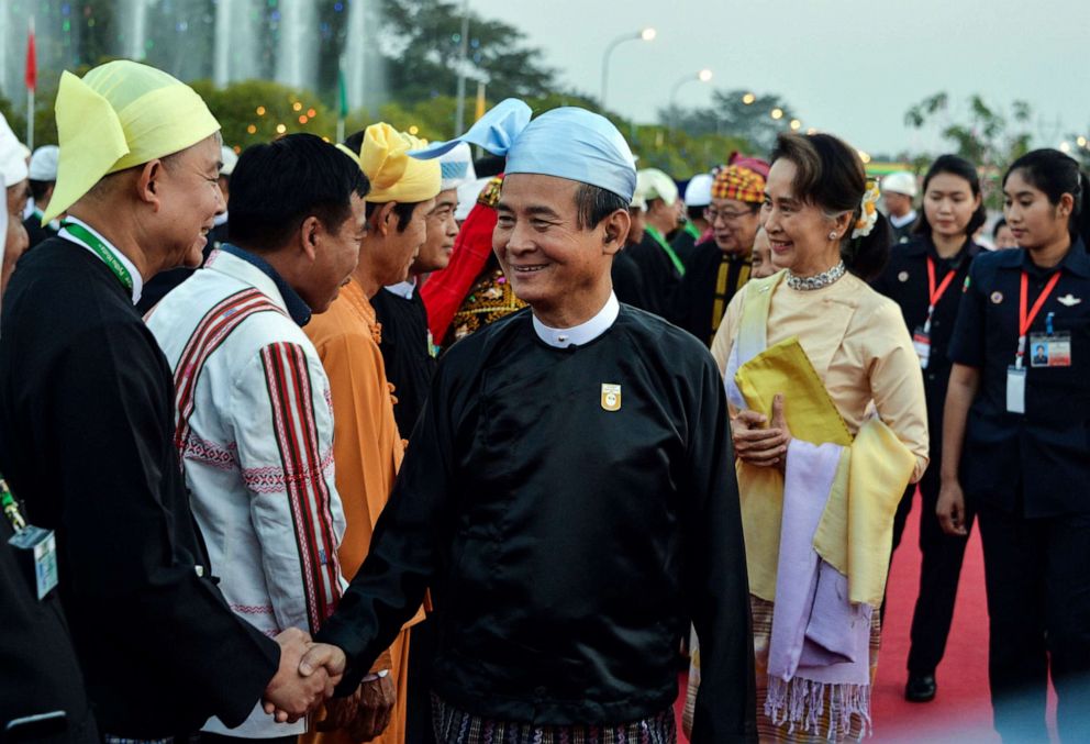 PHOTO: Myanmar's President Win Myint and Myanmar State Counsellor Aung San Suu Kyi arrive to attend a reception to mark the 72nd anniversary of country's National Union Day in Naypyidaw, Feb. 12, 2019.