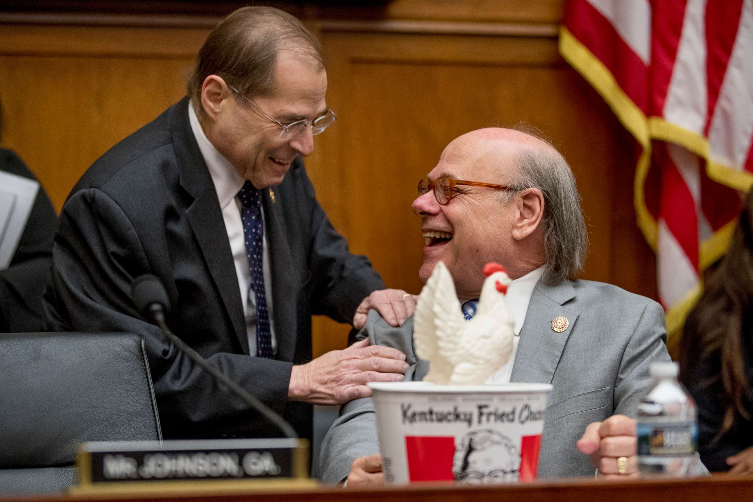 PHOTO: Judiciary Committee Chairman Jerrold Nadler, left, laughs with Rep. Steve Cohen, right, after Cohen arrived with a bucked of fried chicken as Attorney General William Barr skipped the House Judiciary Committee hearing on Capitol Hill, May 2, 2019.