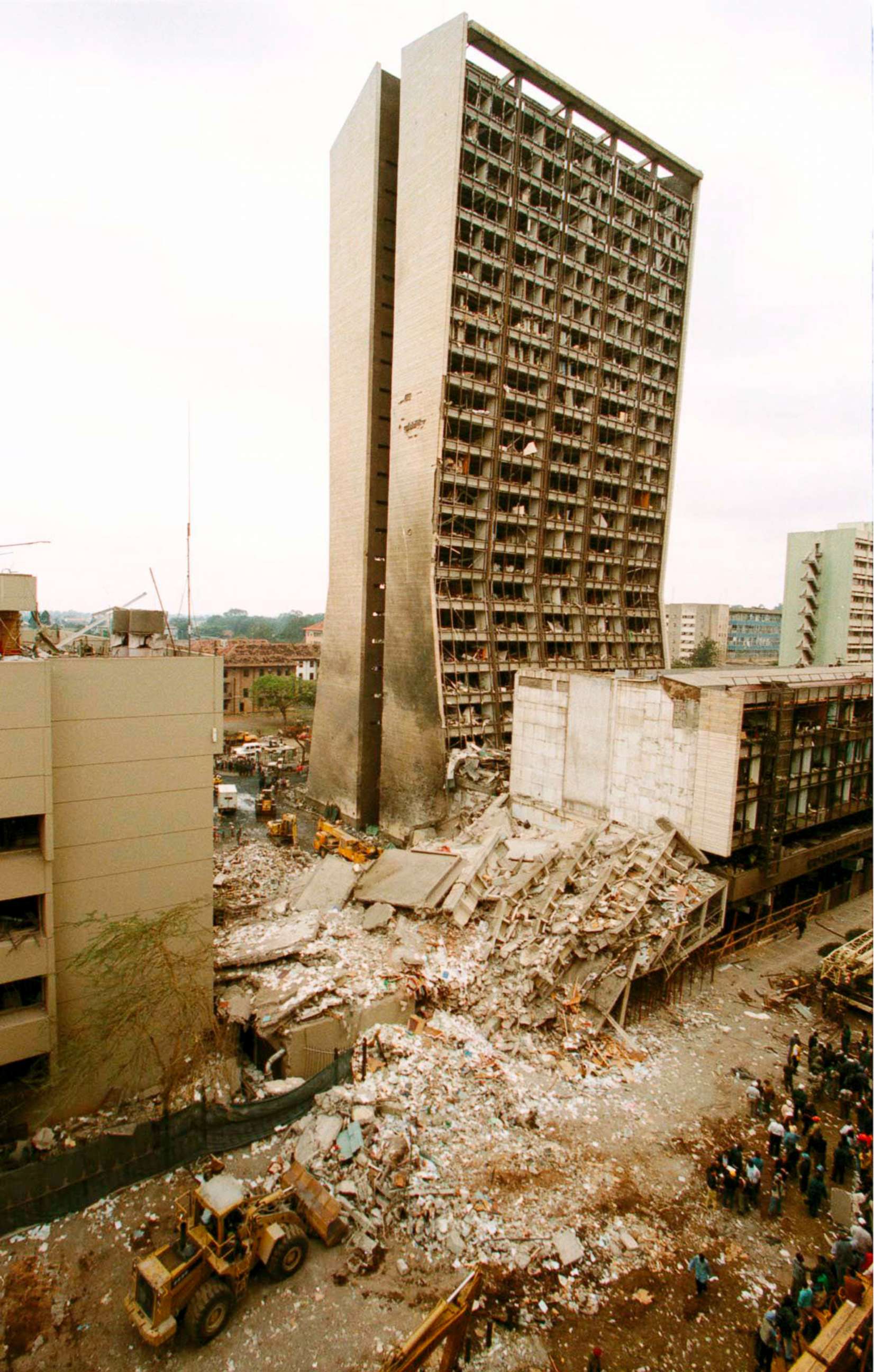 PHOTO: Rescue workers gather in front of buildings devastated by a massive explosion which gutted the US Embassy in Nairobi, Kenya, Aug. 8, 1998.