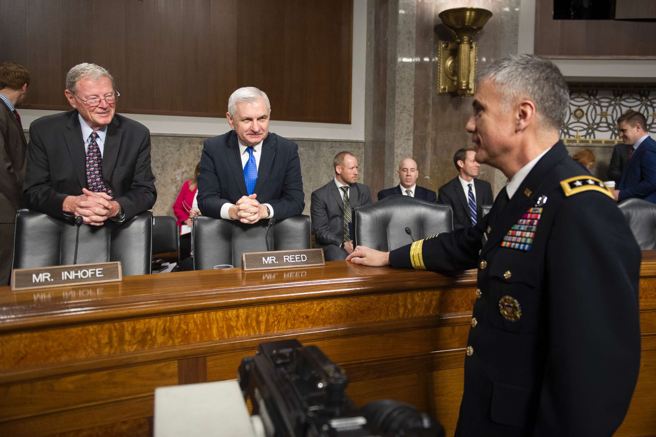 PHOTO: Army Lieutenant General Paul Nakasone, right, talks with Senate Armed Services Committee Chairman James Inhofe, R-Okla., left, and ranking member Sen. Jack Reed, D-R.I., during a hearing on Capitol Hill in Washington, March 1, 2018. 