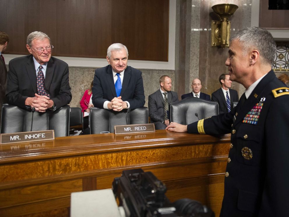 PHOTO: Army Lieutenant General Paul Nakasone, right, talks with Senate Armed Services Committee Chairman James Inhofe, R-Okla., left, and ranking member Sen. Jack Reed, D-R.I., during a hearing on Capitol Hill in Washington, March 1, 2018.