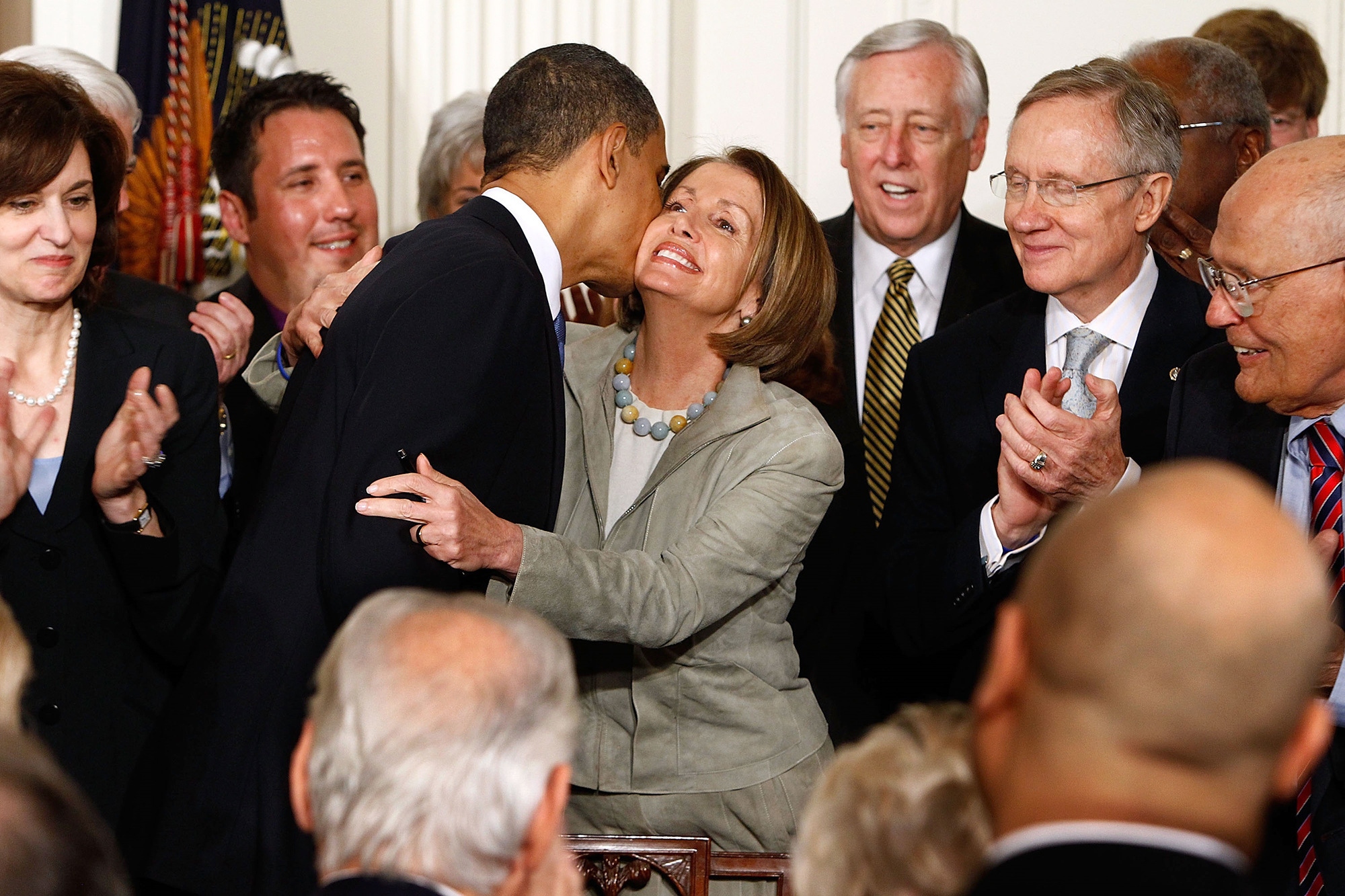 PHOTO: President Barack Obama kisses Speaker of the House Nancy Pelosi after signing the Affordable Health Care for America Act during a ceremony in the East Room of the White House, March 23, 2010.
