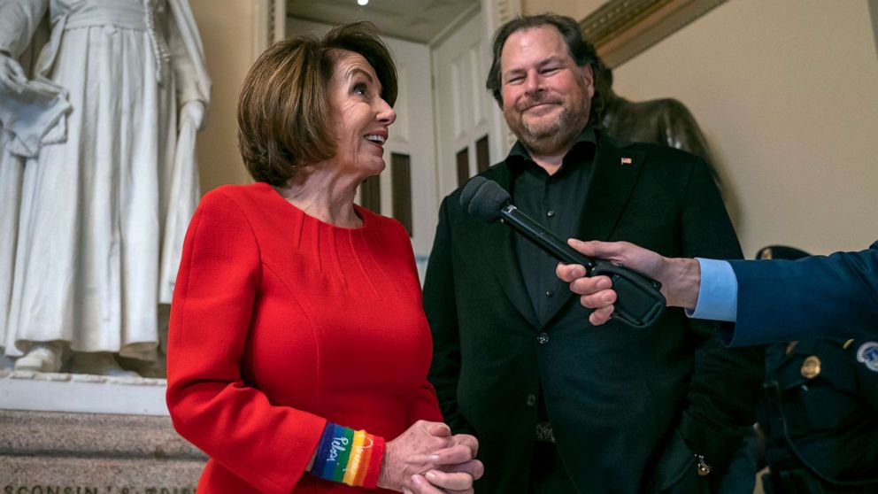 PHOTO: Speaker of the House Nancy Pelosi, joined by internet entrepreneur Marc Benioff, right, arrives for the vote on The Equality Act of 2019 at the Capitol in Washington, May 17, 2019.