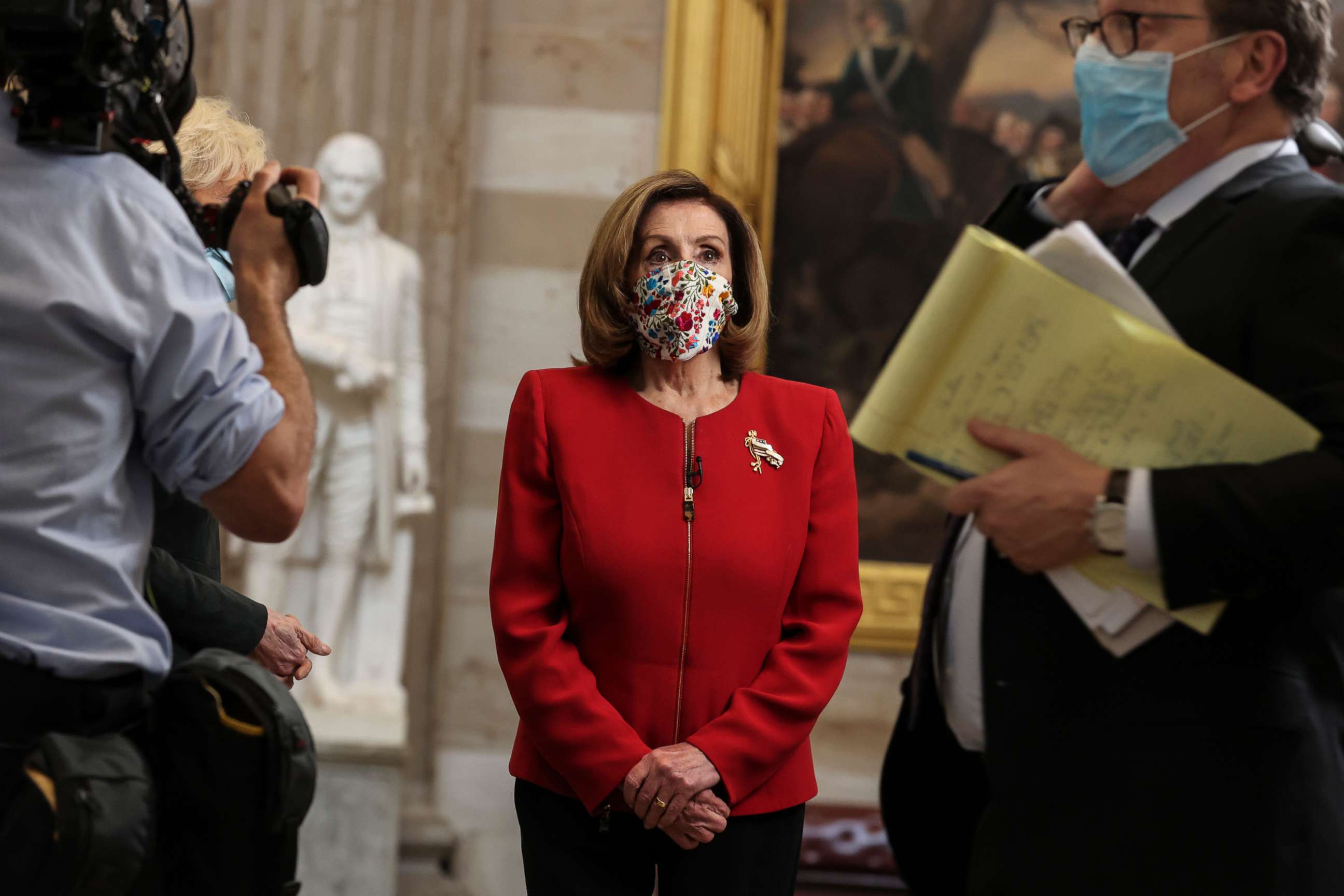 PHOTO: Speaker of the House Nancy Pelosi walks with CBS's 60 Minutes, Lesley Stahl, at the Capitol Rotunda of the US Capitol building during an interview on Jan. 8, 2021, in Washington, DC.