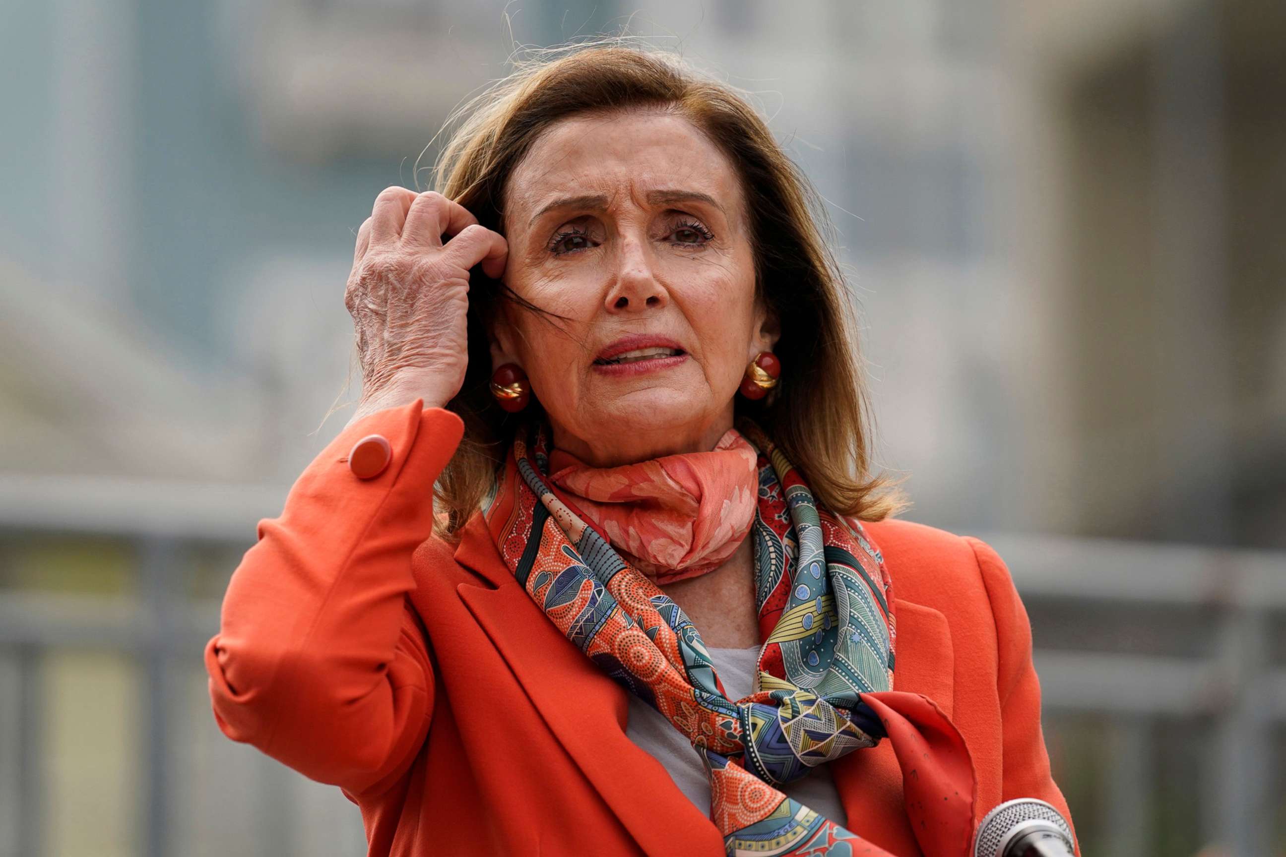 PHOTO: House Speaker Nancy Pelosi pulls back her hair while speaking about her visit to a hair salon during a news conference at the Mission Education Center Elementary School Wednesday, Sept. 2, 2020, in San Francisco.